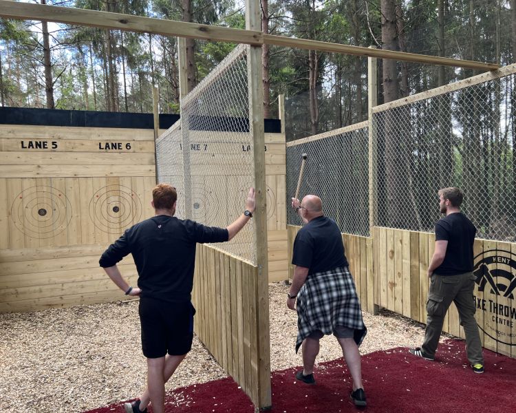 people throwing axes on an axe throwing experience in tunbridge wells in kent
