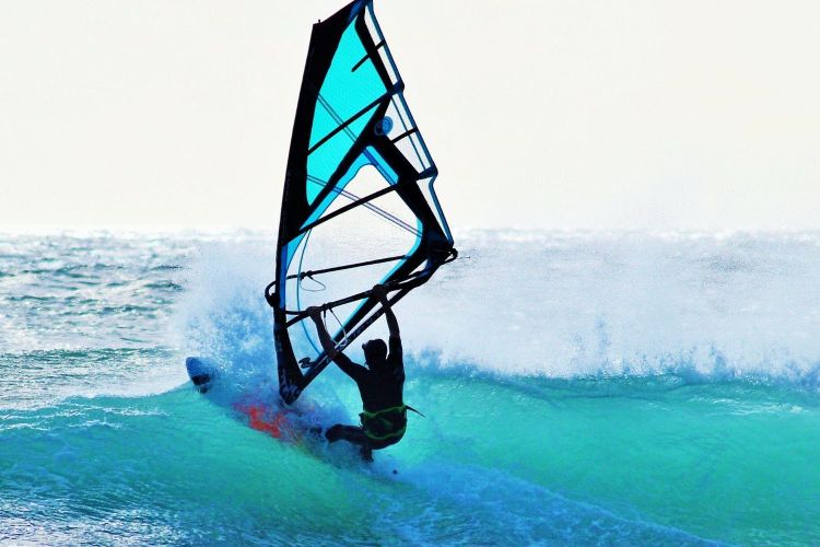 Woman windsurfing in the sea