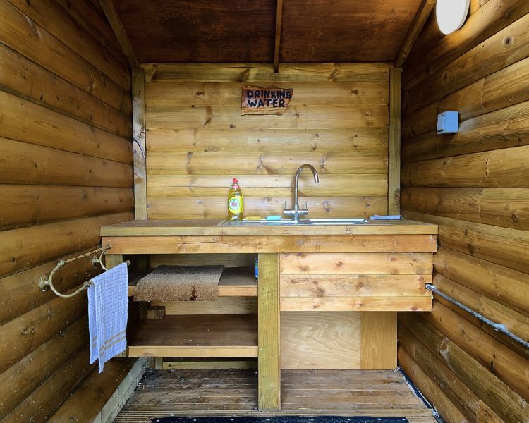 an outdoor sink and drinking water area used for glamping experience in cambridgeshire