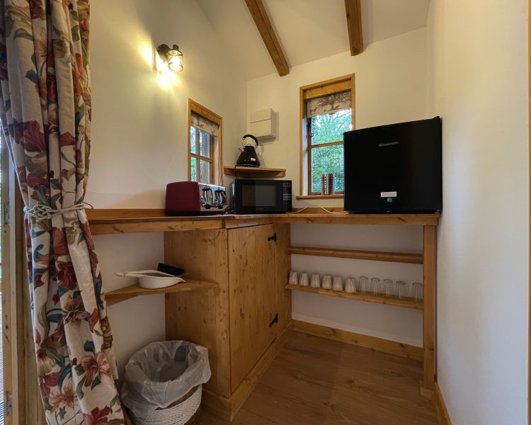 the kitchenette area of beavers house wooden cabin on glamping experience in cambridgeshire