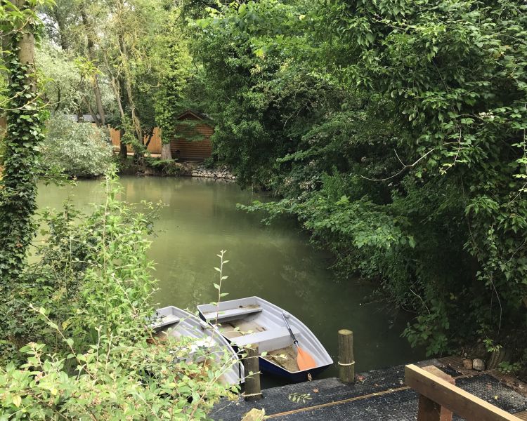 the boating lake of a glamping site in cambridgeshire