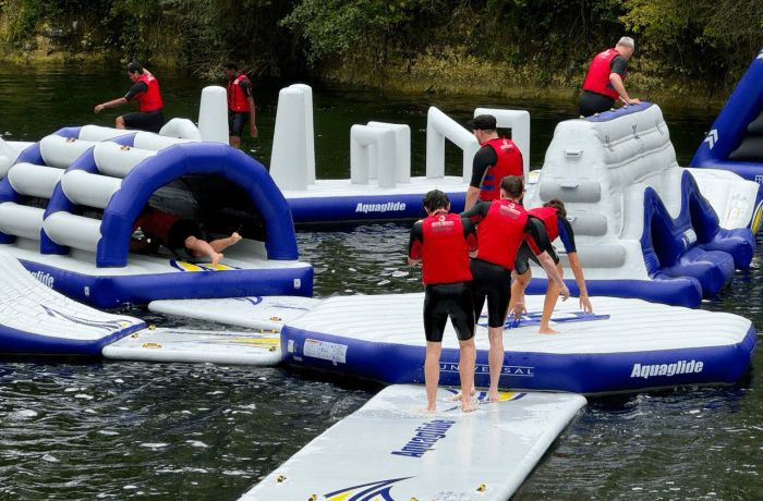 People playing on inflatable waterpark