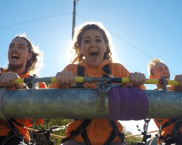 3 people on gravity swing