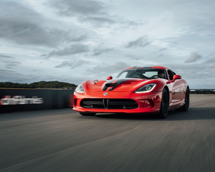 front view of a red porche viper on a race track