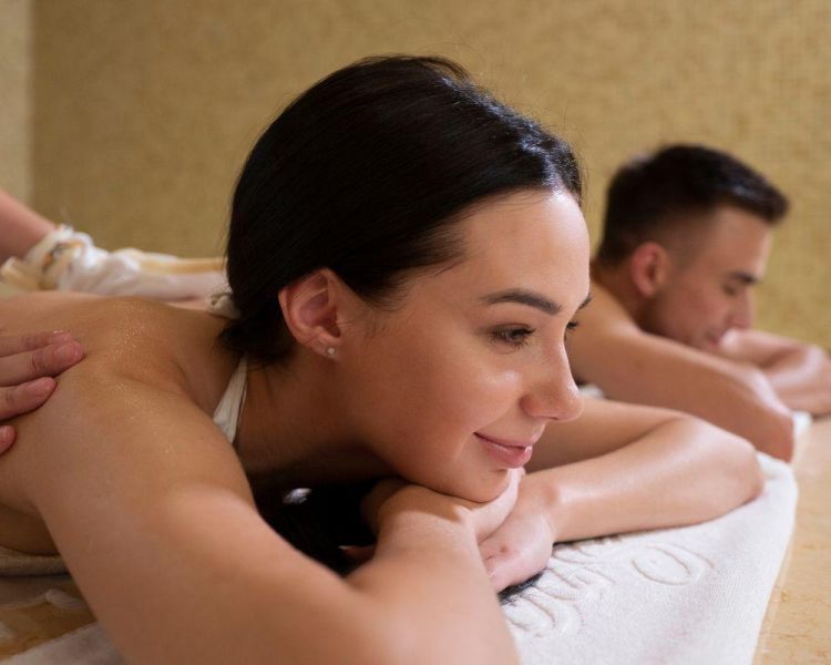 Man and woman having back massage