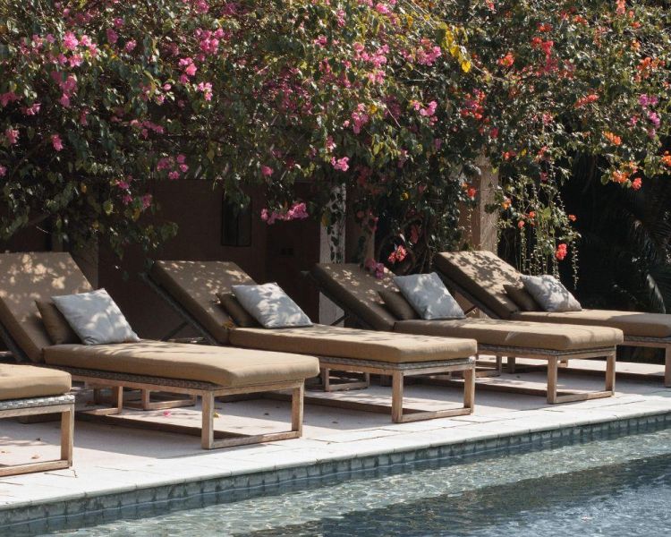 Swimming pool with sun loungers