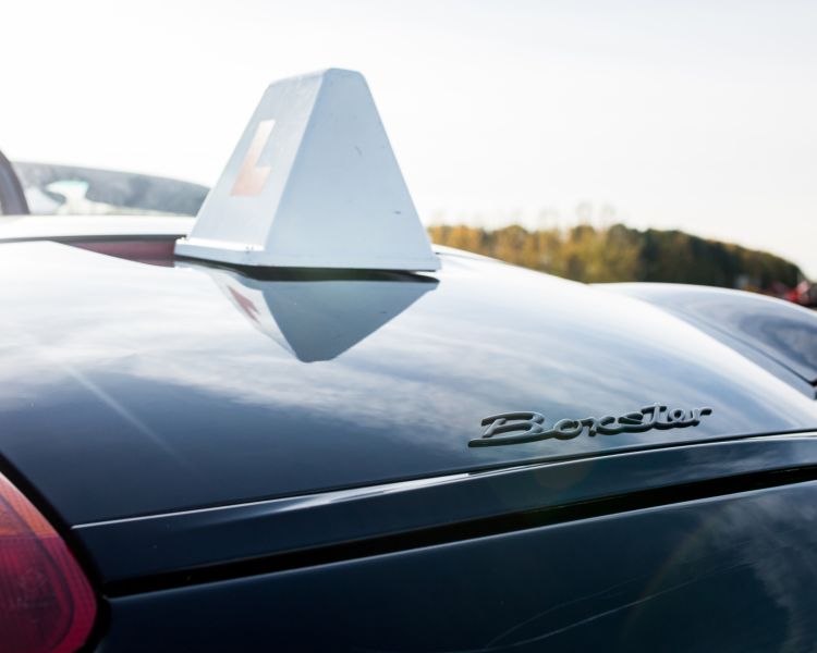 close up of the roof of a black porche boxter