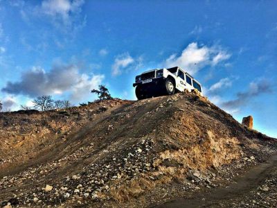 Young person taking part in a Land Rover off road driving experience