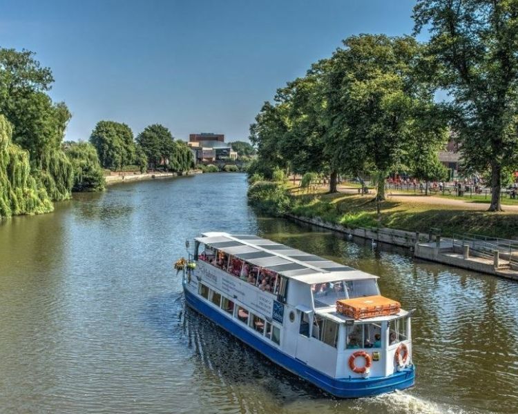 the sabrina river cruise boat sailing down the river severn on a sunny day