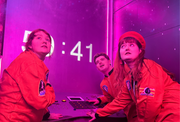 three people in an escape room in liverpool called supernova