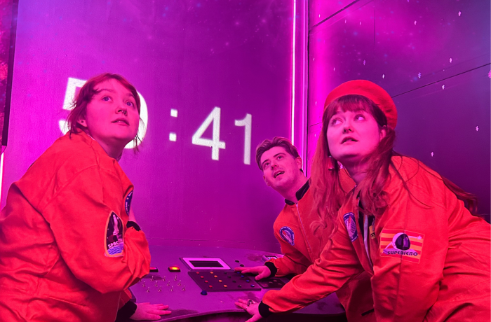 three people in an escape room in liverpool called supernova