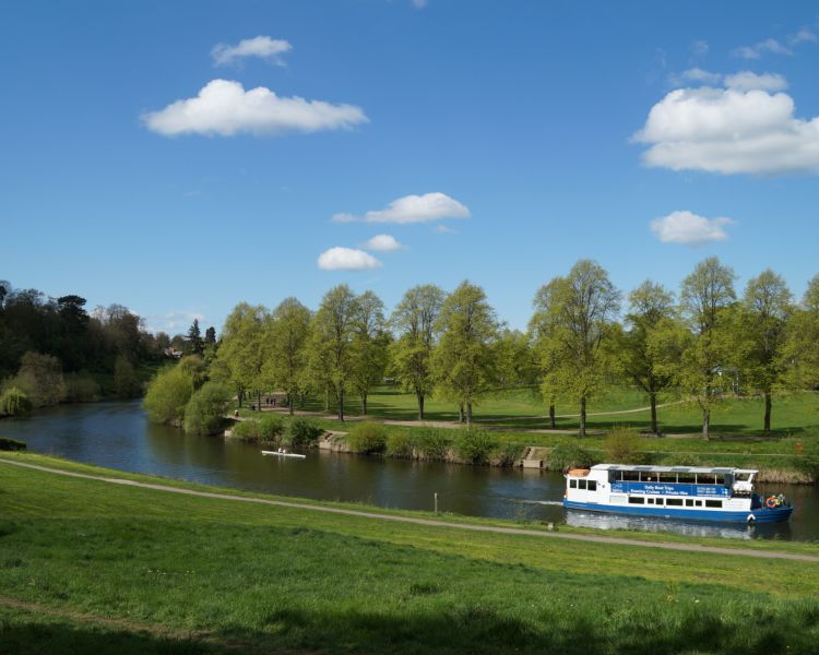 river cruise boat sailing down the river severn on a sunny day in shropshire