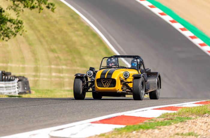 a caterham seven on the race track for a driving experience