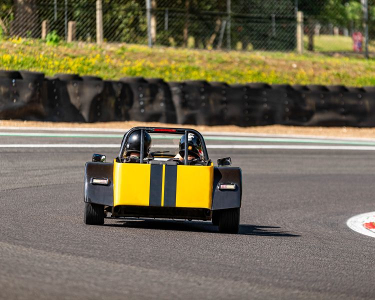 a caterham seven on the race track for a driving experience