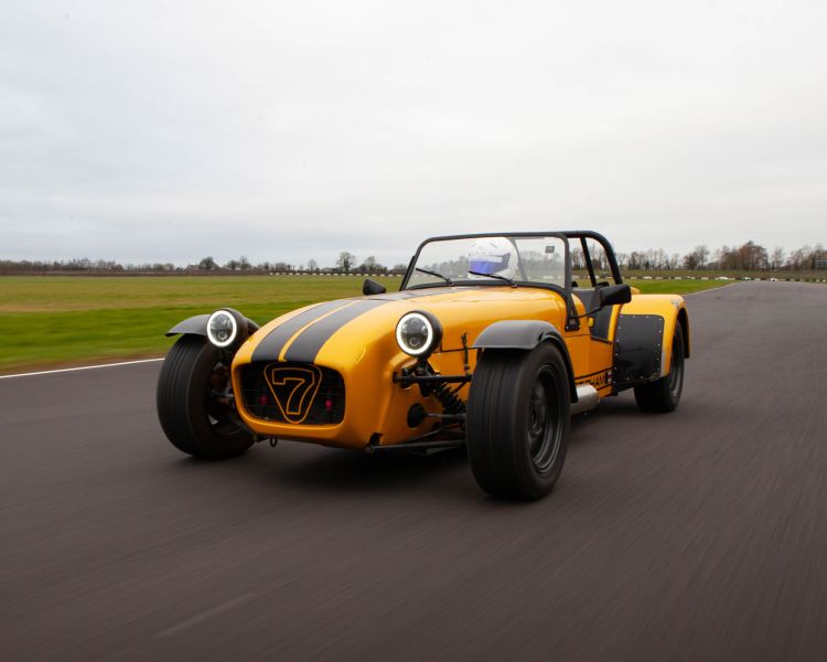 a caterham seven on the race track for a driving experience