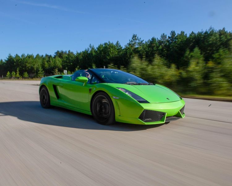 a green lamborghini on a race track for a driving experience day