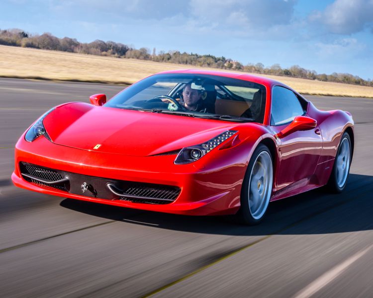 a red ferrari on a race track for a driving experience day