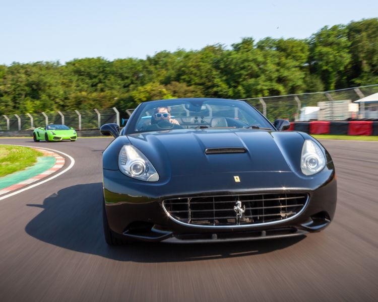 a black ferrari on a race track for a driving experience day