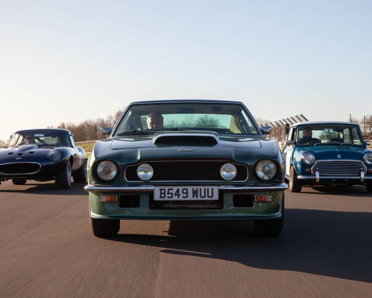 three classic cars on a race track for a supercar vs classic car driving experience