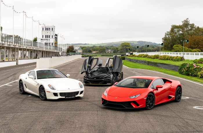 three supercars on a race track for a driving experience