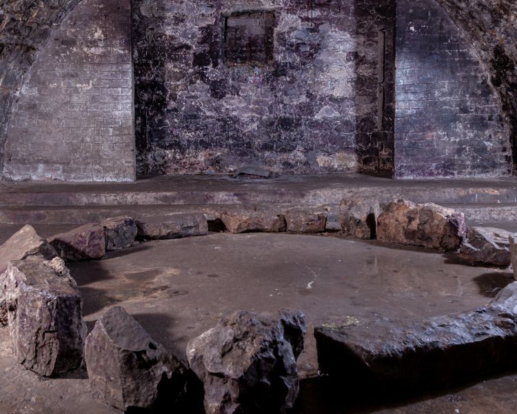 A stone circle in underground vaults seen on a vaults and graveyard walking tour in edingburgh
