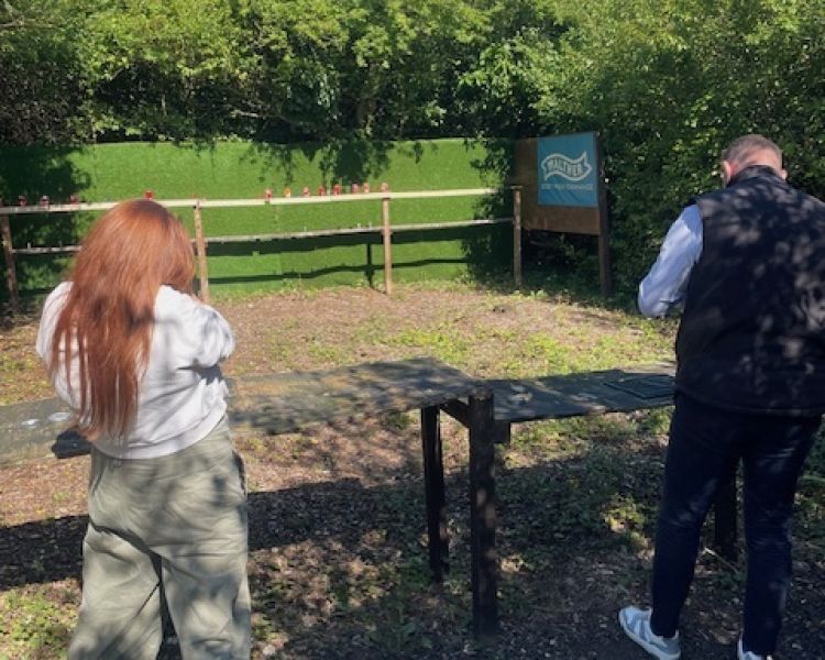 Man and woman on a pistol shooting experience