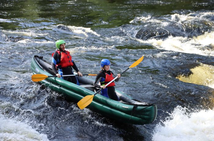 two people on a river duckie experience on the river tay in scotland
