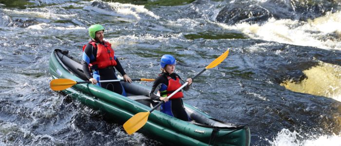 two people on a river duckie experience on the river tay in scotland