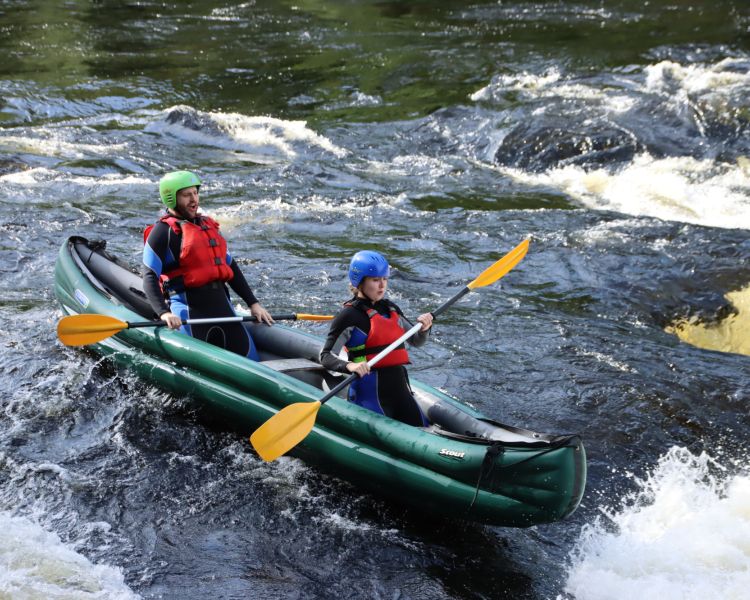 two people on a river duckie experience on the river tay in scotland