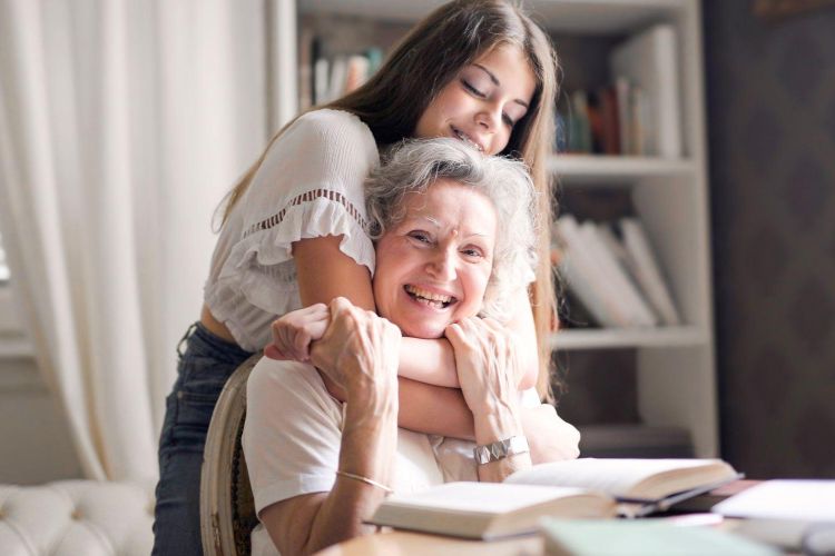 Woman hugging her grandmother
