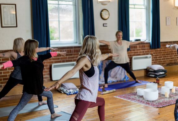 women at a yoga class on a mindfulness day retreat experience