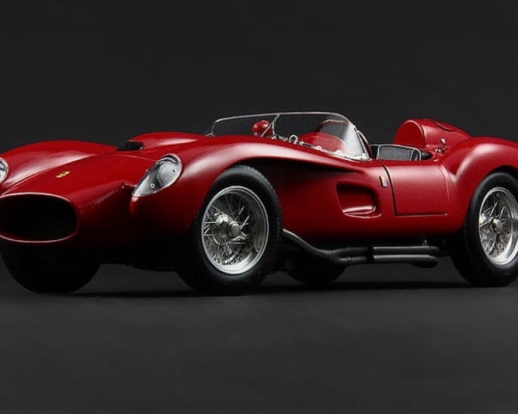 a dark red ferrari 250 testa rossa sports car