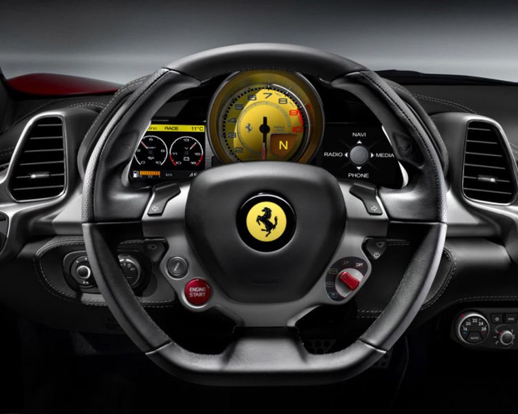 a close up of the steering wheel and dashboard of a ferrari as part of a ferrari driving experience day