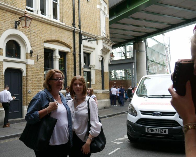 2 women posing for a photo infront of a town house on a bridget jones film locations walking tour in london