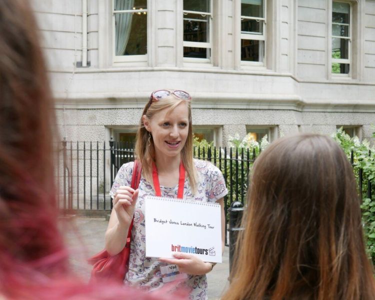 Tour guide talking to group on a bridget jones film locations walking tour in london