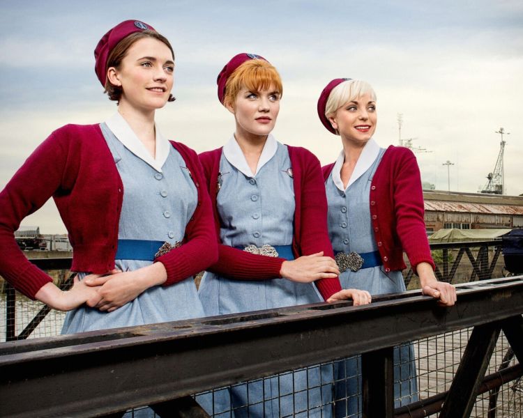 Three characters from call the midwife posing at chatham dockyard