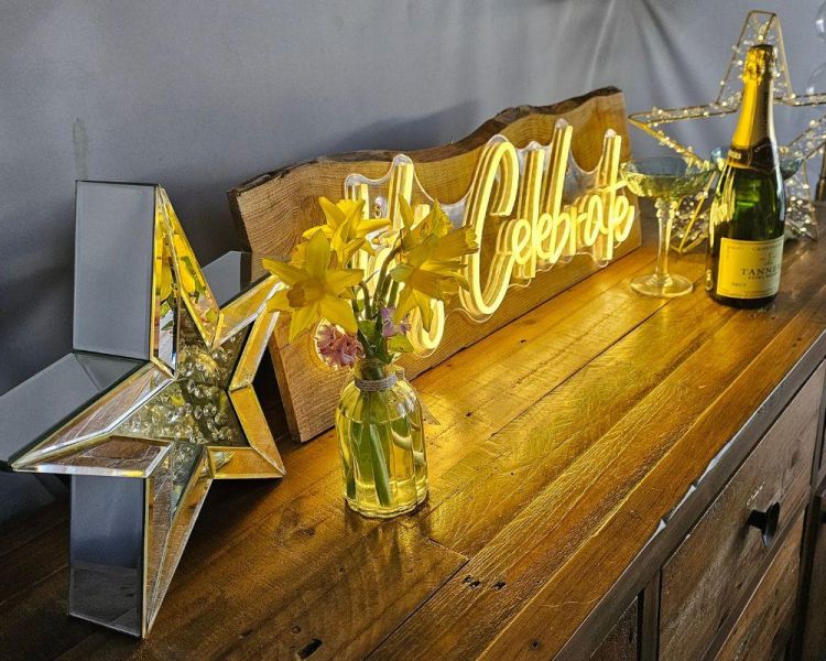 Celebrate sign and prosecco inside star dome