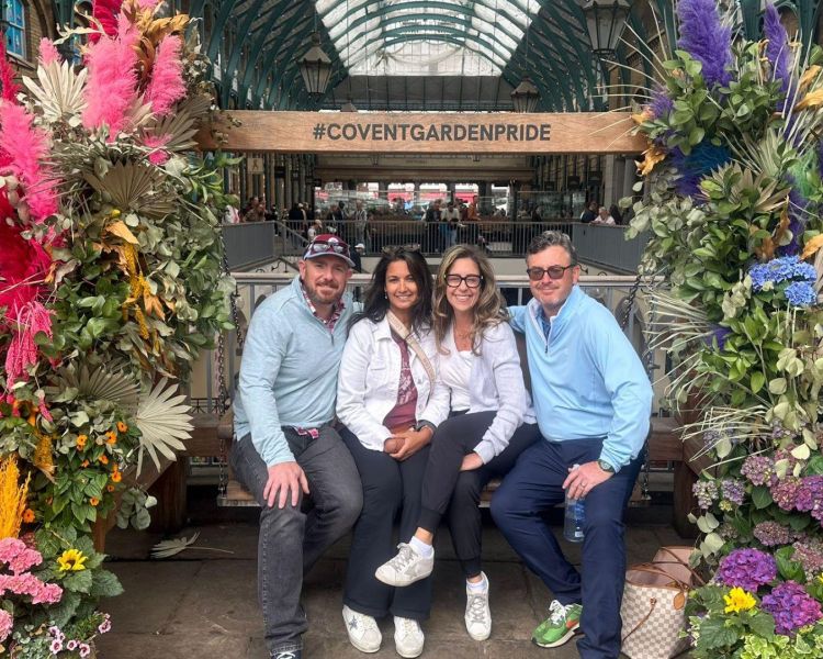 Four people posing for photo in covent garden on a london tour