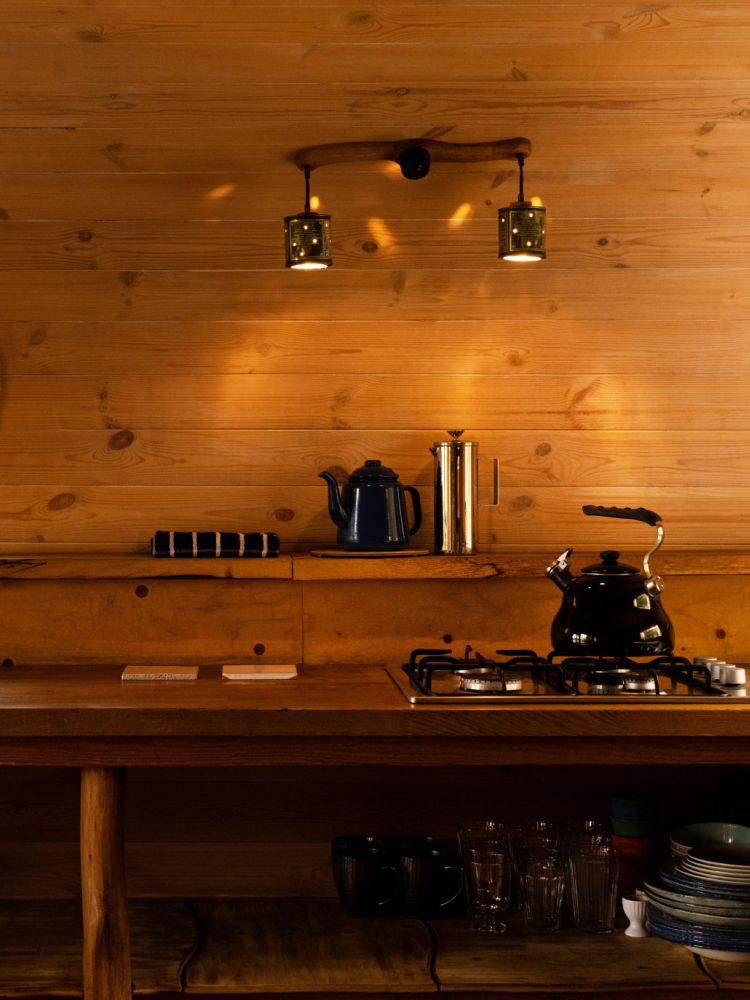 the kitchen area inside a treehouse in the woods in wales