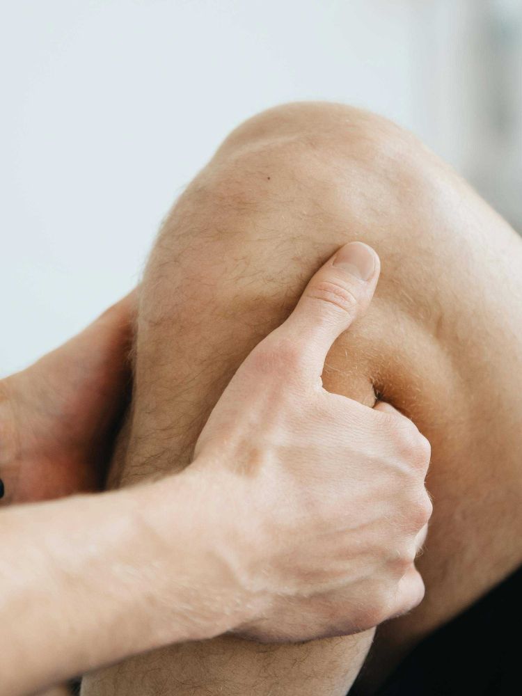 man having a muscle recovery leg massage
