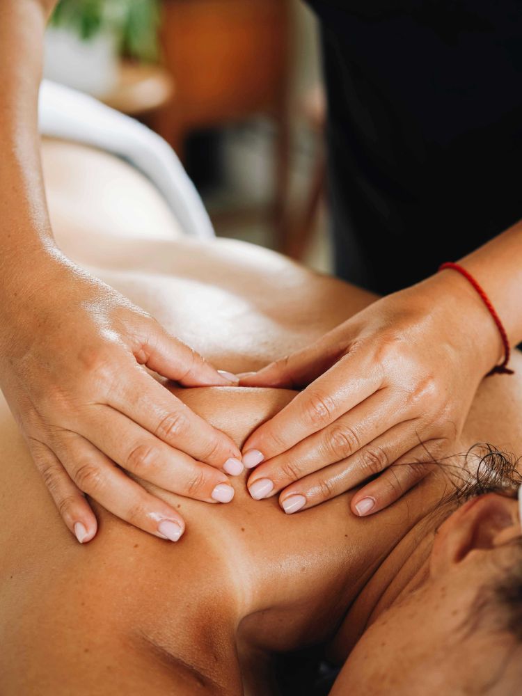 woman having a muscle recovery neck massage