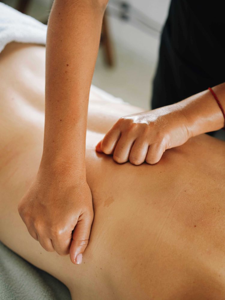 woman having a muscle recovery back massage