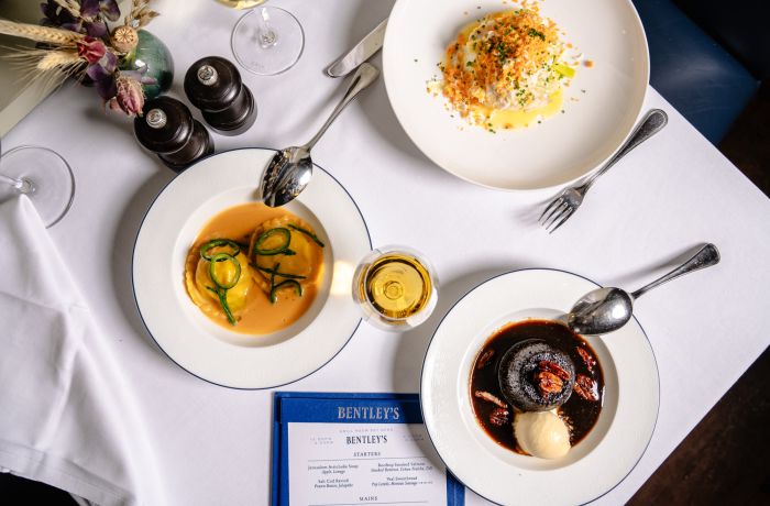 a table laid out for a seafood dining experience at bentley's mayfair