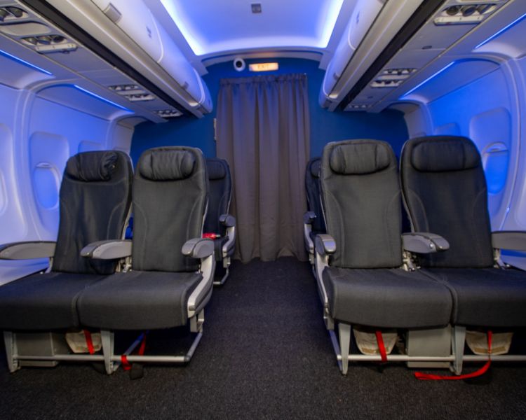 the cabin area of a boeing 737 flight simulator at luton airport