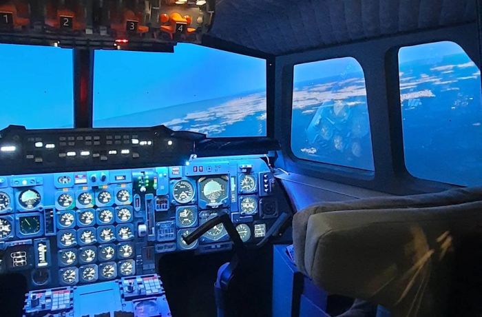 Inside of the concorde flight simulator showing the cockpit with controls