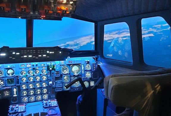 Inside of the concorde flight simulator showing the cockpit with controls
