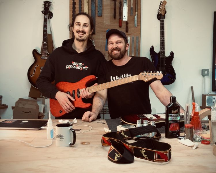 2 men with guitars