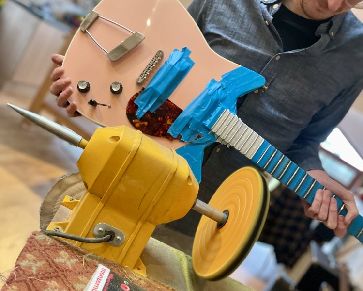 Electric guitar being rewired