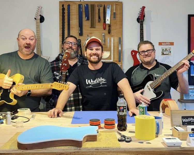 Group of men holding guitars
