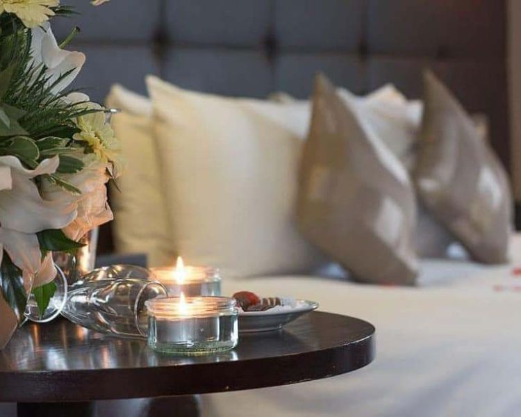 double bedroom with tealights on table at four star shropshire hotel